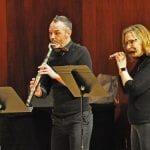 a flutist and piccoloist performing at the 2022 COFA Flute Choir Shocase